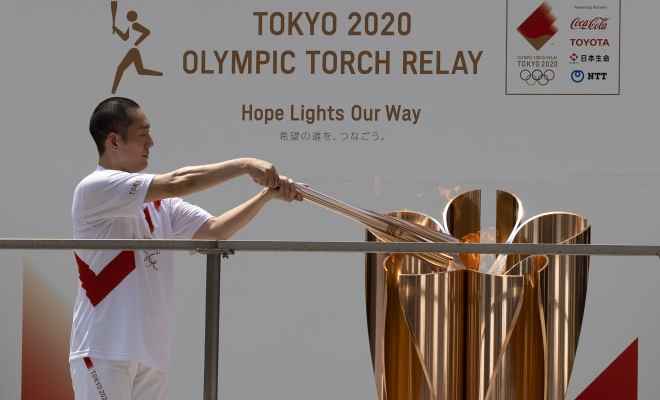 وصول الشعلة الاولمبية الى شينجوكو طوكيو